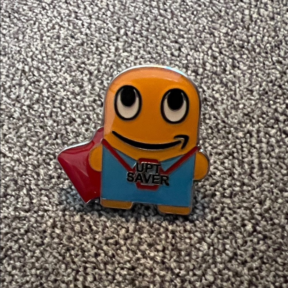 Superhero UPT saver Peccy Enamel Pin - Yellow, Blue & Red